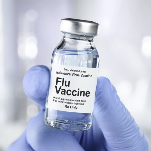 Small drug vial with influenza vaccine Flu Season